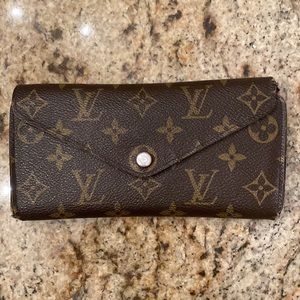 Used Louis Vuitton's classic wallet Monogram canvas grained-leather lini…
